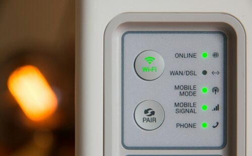 White modem with lots of nice LEDs turned on